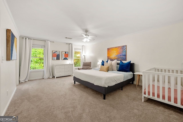 3714 Westbrooke Cir, Brookhaven, GA 30319 - carpeted bedroom with crown molding, baseboards, and a ceiling fan