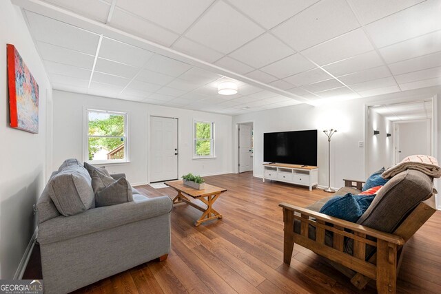 3714 Westbrooke Cir, Brookhaven, GA 30319 - living room featuring a paneled ceiling, wood finished floors, and baseboards