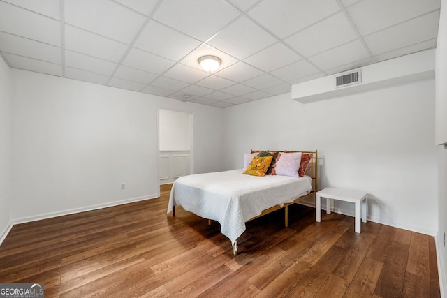 3714 Westbrooke Cir, Brookhaven, GA 30319 - bedroom featuring a paneled ceiling, wood finished floors, and baseboards
