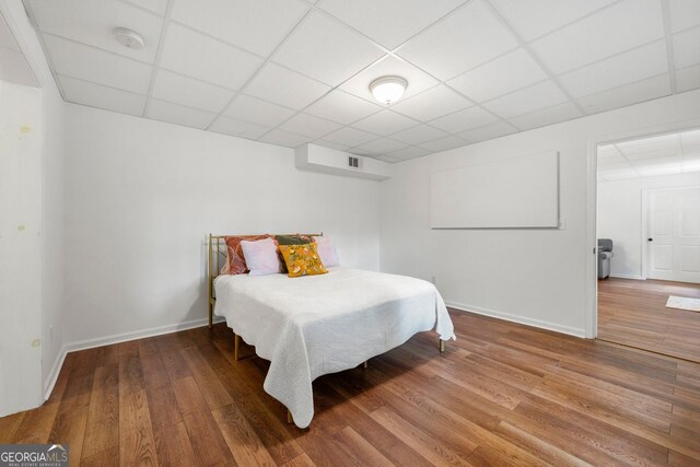 3714 Westbrooke Cir, Brookhaven, GA 30319 - bedroom featuring a paneled ceiling, baseboards, and wood finished floors