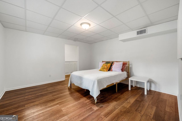 3714 Westbrooke Cir, Brookhaven, GA 30319 - bedroom featuring a paneled ceiling, wood finished floors, and baseboards