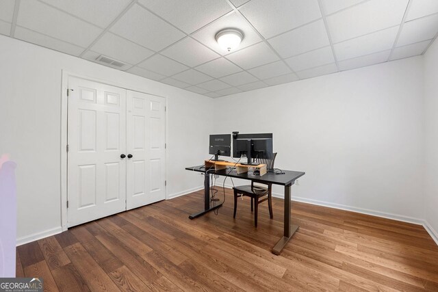 3714 Westbrooke Cir, Brookhaven, GA 30319 - office featuring a paneled ceiling, wood finished floors, and baseboards
