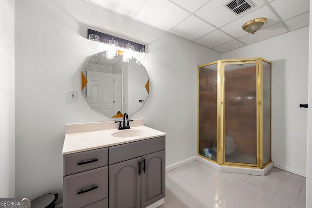 3714 Westbrooke Cir, Brookhaven, GA 30319 - bathroom with vanity, a stall shower, tile patterned flooring, baseboards, and a paneled ceiling