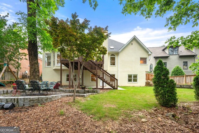 3714 Westbrooke Cir, Brookhaven, GA 30319 - rear view of house featuring stairway, stucco siding, a patio, and a deck