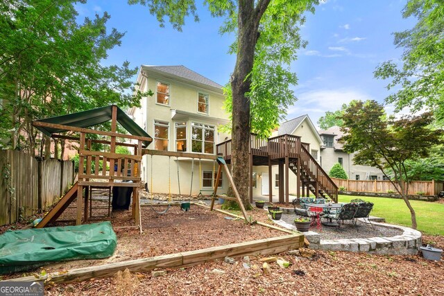 3714 Westbrooke Cir, Brookhaven, GA 30319 - view of jungle gym with stairs, a wooden deck, and a patio