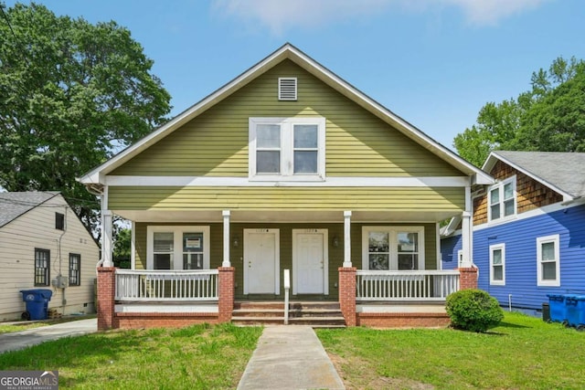 1177 Arlington Ave SW, Atlanta, GA 30310 - view of front of home featuring covered porch and a front yard