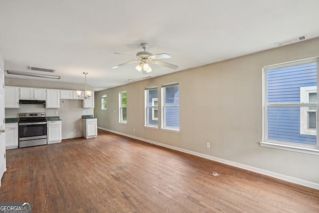 1177 Arlington Ave SW, Atlanta, GA 30310 - kitchen featuring stainless steel range with electric stovetop, extractor fan, a chandelier, and baseboards