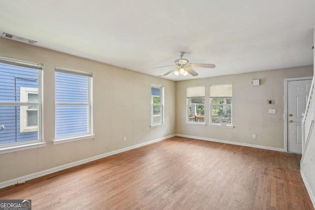 1177 Arlington Ave SW, Atlanta, GA 30310 - spare room featuring light wood finished floors, ceiling fan, and baseboards