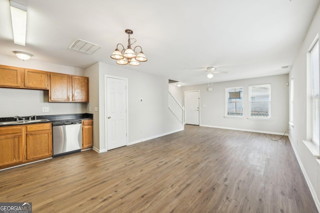 1177 Arlington Ave SW, Atlanta, GA 30310 - kitchen with dishwasher, a sink, brown cabinetry, and a ceiling fan