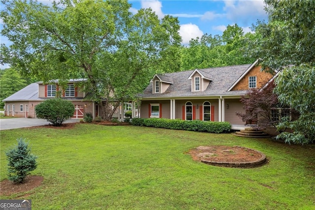 1451 Tappan Spur Dr, Watkinsville, GA 30677 - view of front of house with a front yard, a porch, and driveway