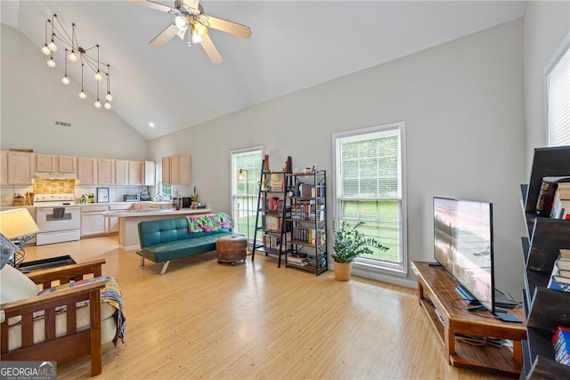 1451 Tappan Spur Dr, Watkinsville, GA 30677 - living area featuring light wood-style floors, ceiling fan, and high vaulted ceiling