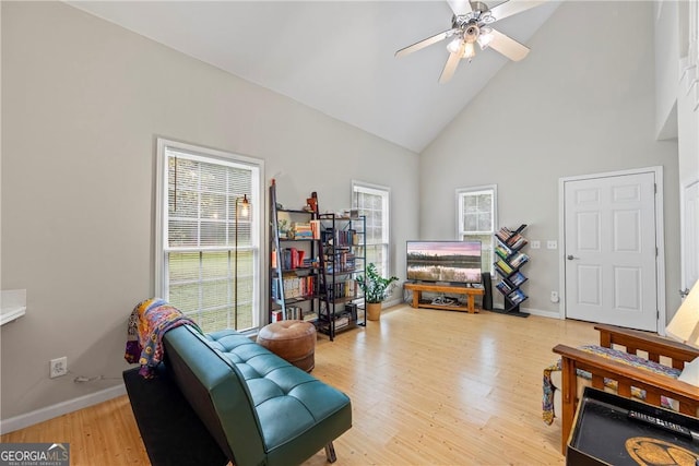1451 Tappan Spur Dr, Watkinsville, GA 30677 - living room featuring high vaulted ceiling, ceiling fan, baseboards, and light wood finished floors