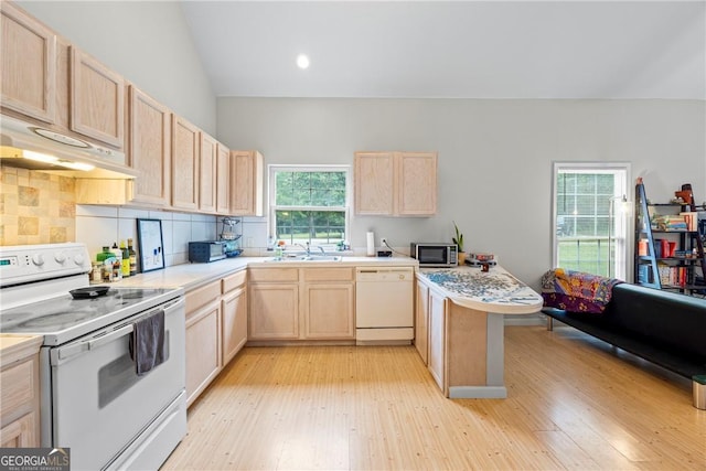 1451 Tappan Spur Dr, Watkinsville, GA 30677 - kitchen featuring white appliances, light brown cabinets, a sink, under cabinet range hood, and light countertops