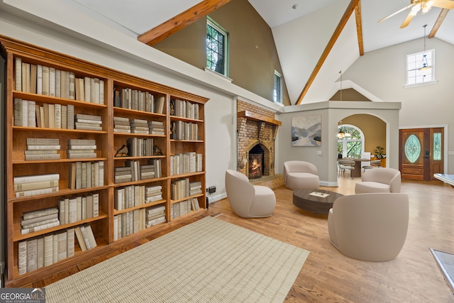 1451 Tappan Spur Dr, Watkinsville, GA 30677 - living area featuring ceiling fan, a fireplace, high vaulted ceiling, plenty of natural light, and wood finished floors