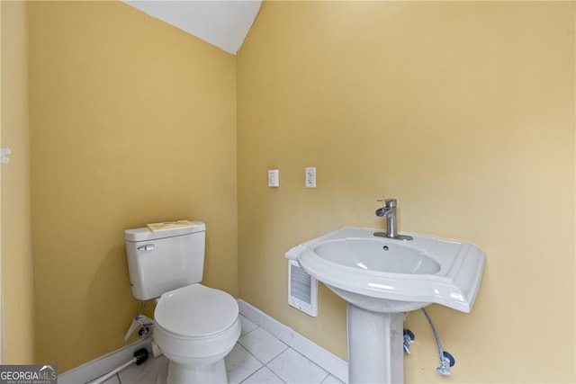 1451 Tappan Spur Dr, Watkinsville, GA 30677 - half bath with toilet, tile patterned floors, lofted ceiling, and baseboards