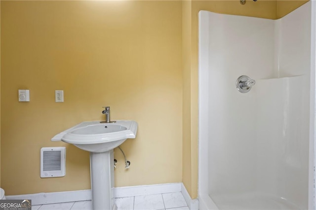 1451 Tappan Spur Dr, Watkinsville, GA 30677 - bathroom featuring a shower stall and baseboards