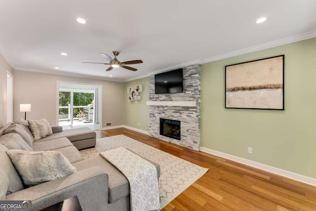2356 Defoors Ferry Rd NW, Atlanta, GA 30318 - living room featuring wood finished floors, ceiling fan, ornamental molding, a fireplace, and baseboards