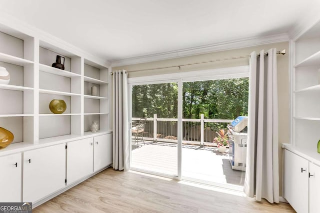 2356 Defoors Ferry Rd NW, Atlanta, GA 30318 - doorway to outside with light wood finished floors and crown molding