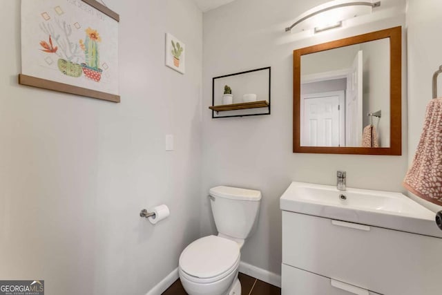2356 Defoors Ferry Rd NW, Atlanta, GA 30318 - half bathroom with vanity, toilet, and baseboards