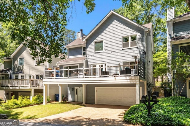 2356 Defoors Ferry Rd NW, Atlanta, GA 30318 - view of front of house with an attached garage, concrete driveway, a chimney, and a front yard