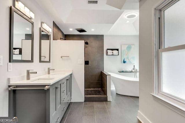 2356 Defoors Ferry Rd NW, Atlanta, GA 30318 - bathroom with double vanity, a soaking tub, walk in shower, tile patterned flooring, and recessed lighting