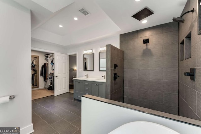 2356 Defoors Ferry Rd NW, Atlanta, GA 30318 - bathroom with double vanity, walk in shower, recessed lighting, a spacious closet, and tile patterned flooring