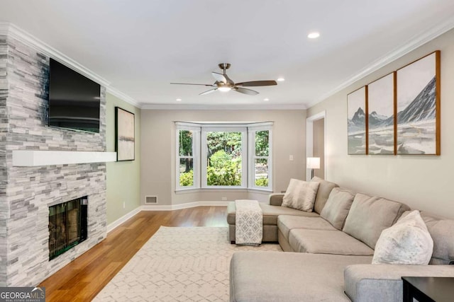 2356 Defoors Ferry Rd NW, Atlanta, GA 30318 - living area with ceiling fan, wood finished floors, a stone fireplace, recessed lighting, and ornamental molding