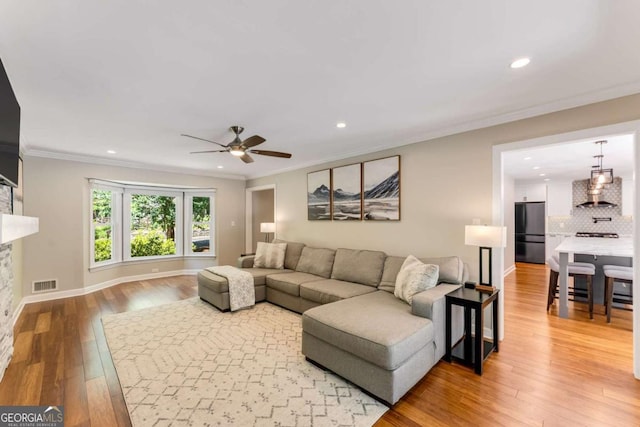 2356 Defoors Ferry Rd NW, Atlanta, GA 30318 - living area featuring recessed lighting, light wood-type flooring, crown molding, a ceiling fan, and baseboards