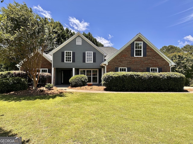 2999 Plantation Run Ct, Loganville, GA 30052 - traditional-style house with a front lawn and brick siding