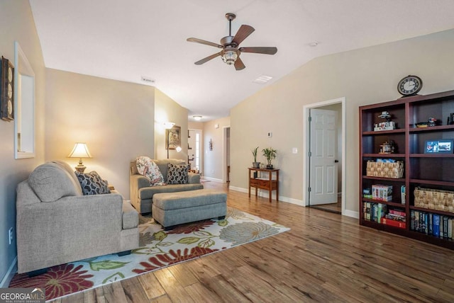 287 Jeremy Dr, Colbert, GA 30628 - living area with a ceiling fan, wood finished floors, vaulted ceiling, and baseboards