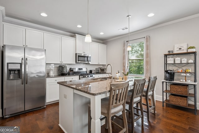2127 Apple Orchard Way, Austell, GA 30168 - kitchen featuring appliances with stainless steel finishes, crown molding, backsplash, dark wood-style flooring, and dark stone counters