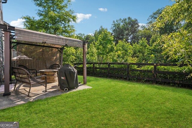 2127 Apple Orchard Way, Austell, GA 30168 - fenced backyard featuring a fire pit, a patio, and a pergola