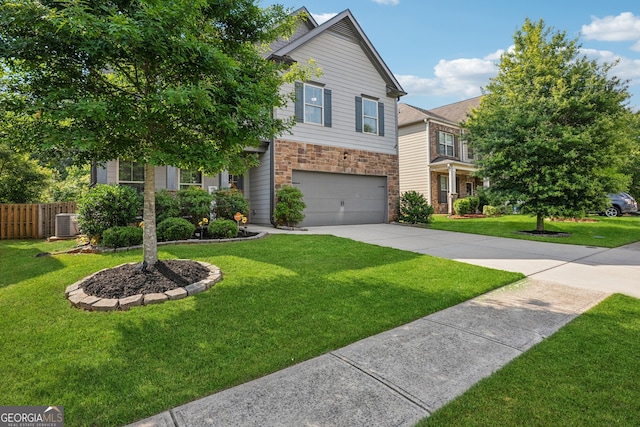 2127 Apple Orchard Way, Austell, GA 30168 - view of front facade featuring a garage, stone siding, and concrete driveway