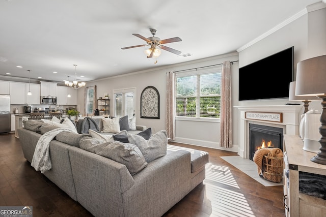 2127 Apple Orchard Way, Austell, GA 30168 - living room featuring a fireplace with flush hearth, recessed lighting, crown molding, dark wood-type flooring, and a ceiling fan