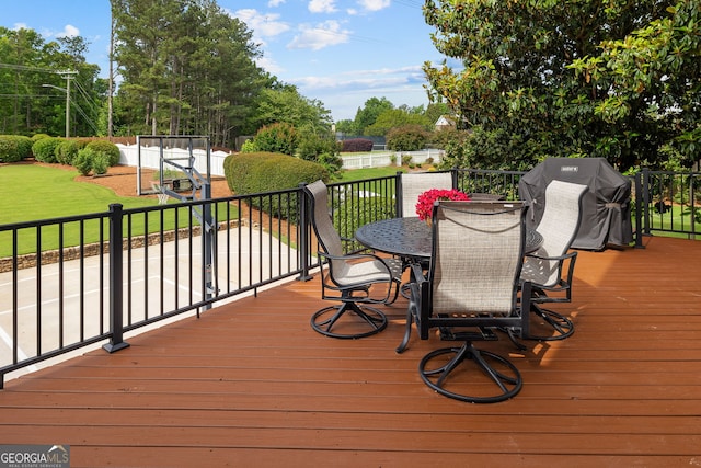 3495 Mill Bridge Dr, Marietta, GA 30062 - wooden terrace with outdoor dining area, a lawn, area for grilling, and view of scattered trees