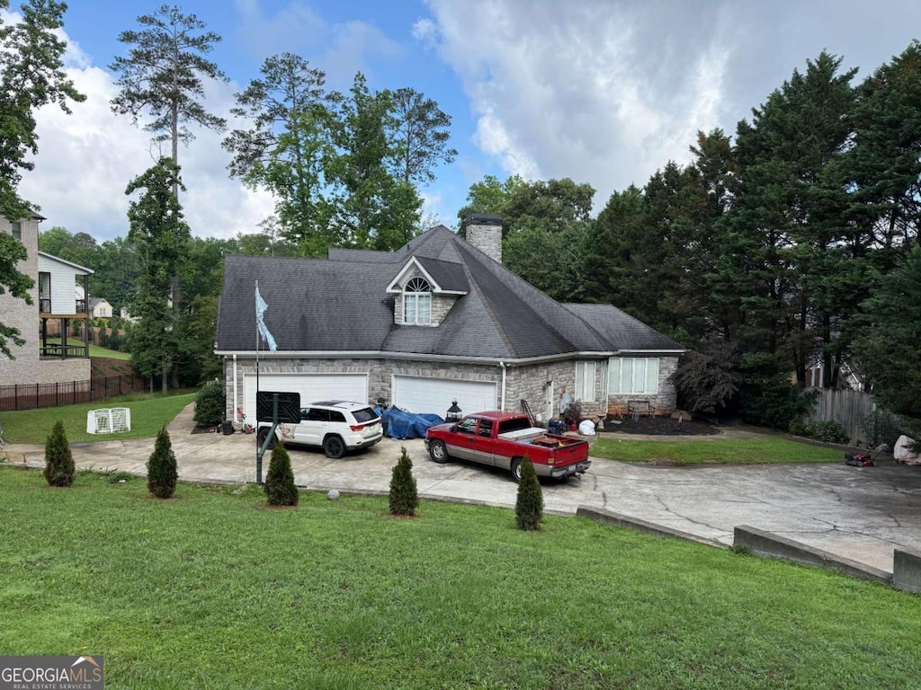 3393 Childers Rd NE, Roswell, GA 30075 - view of side of property with concrete driveway, a garage, and a chimney