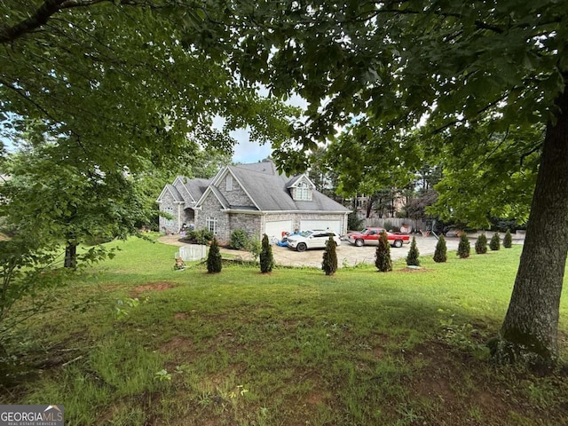 3393 Childers Rd NE, Roswell, GA 30075 - view of green lawn featuring driveway and an attached garage