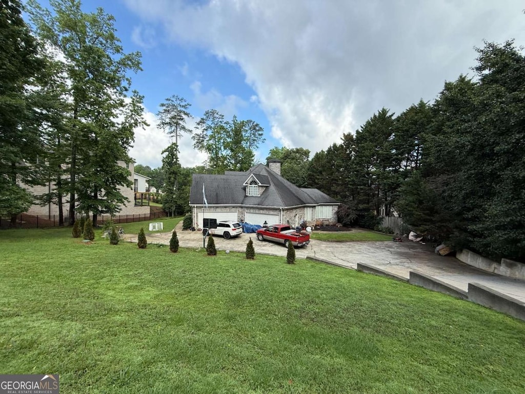 3393 Childers Rd NE, Roswell, GA 30075 - view of grassy yard with concrete driveway