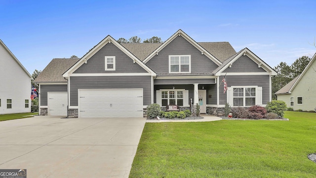 390 Cushing St, Senoia, GA 30276 - craftsman-style house with a front lawn, driveway, stone siding, and covered porch