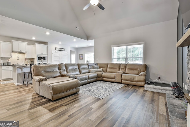 390 Cushing St, Senoia, GA 30276 - living area featuring a ceiling fan, light wood-style floors, high vaulted ceiling, and recessed lighting