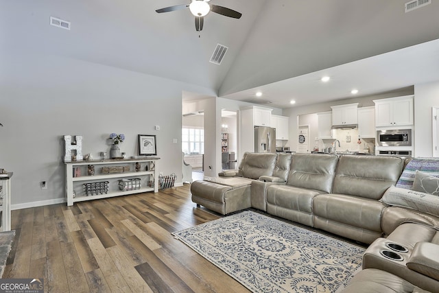 390 Cushing St, Senoia, GA 30276 - living room with ceiling fan, dark wood-type flooring, recessed lighting, baseboards, and high vaulted ceiling