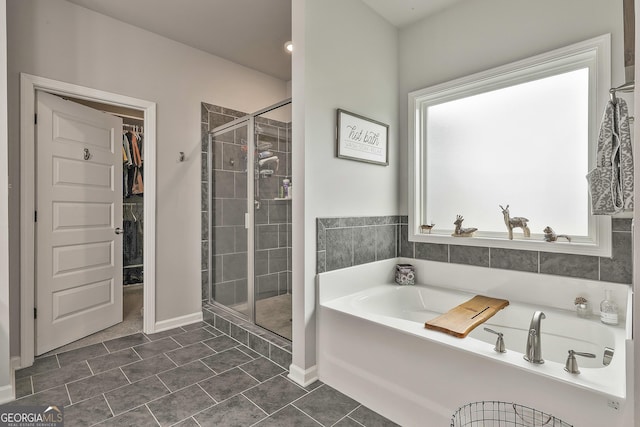 390 Cushing St, Senoia, GA 30276 - bathroom with a garden tub, a shower stall, and a spacious closet