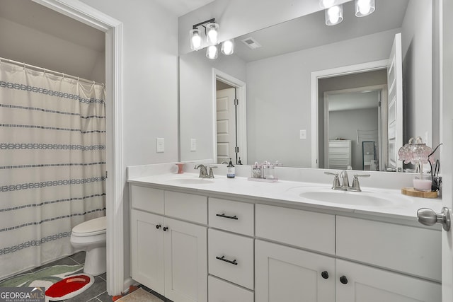 390 Cushing St, Senoia, GA 30276 - bathroom featuring toilet, double vanity, and tile patterned flooring