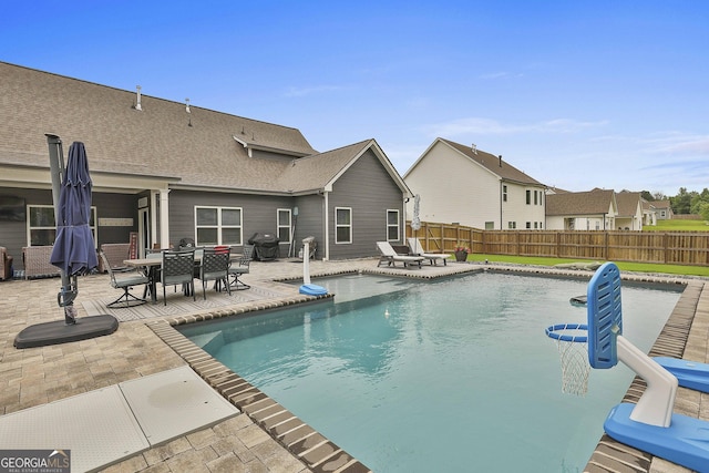 390 Cushing St, Senoia, GA 30276 - view of pool with a patio area, a fenced backyard, area for grilling, and outdoor dining space