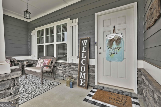 390 Cushing St, Senoia, GA 30276 - doorway to property featuring a porch and stone siding