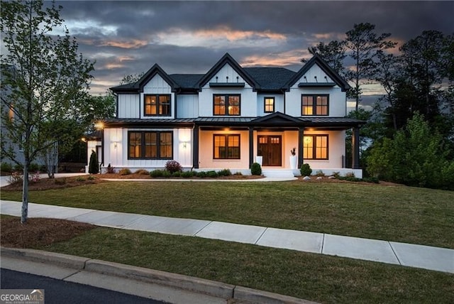 320 Dodd Ln, Alpharetta, GA 30005 - modern farmhouse style home featuring a standing seam roof, a lawn, and a porch