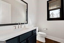 320 Dodd Ln, Alpharetta, GA 30005 - bathroom featuring vanity and toilet