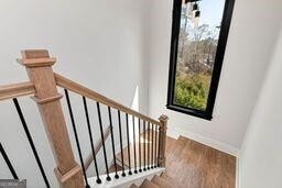 320 Dodd Ln, Alpharetta, GA 30005 - staircase with wood finished floors