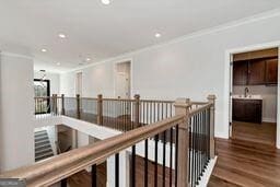 320 Dodd Ln, Alpharetta, GA 30005 - corridor featuring ornamental molding, wood finished floors, recessed lighting, an upstairs landing, and baseboards