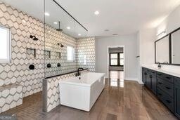 320 Dodd Ln, Alpharetta, GA 30005 - bathroom featuring a freestanding tub, vanity, walk in shower, plenty of natural light, and recessed lighting